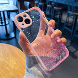 a person holding a pink phone case with glitter