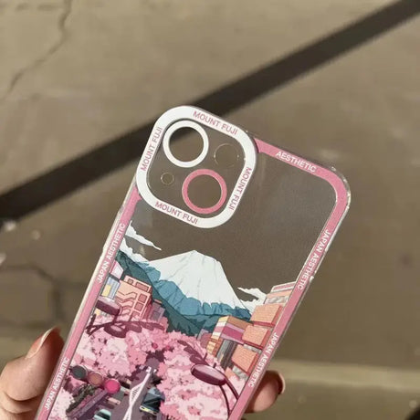 a person holding a pink phone case