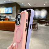 a person holding a pink and purple iphone case