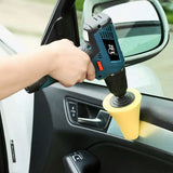 a person using a car polisher to clean the interior