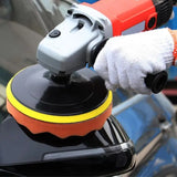 a person using a polisher to polish a car