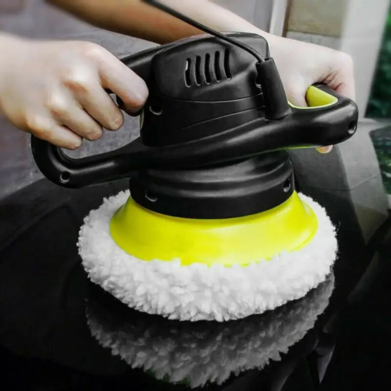 a person using a polisher on a table