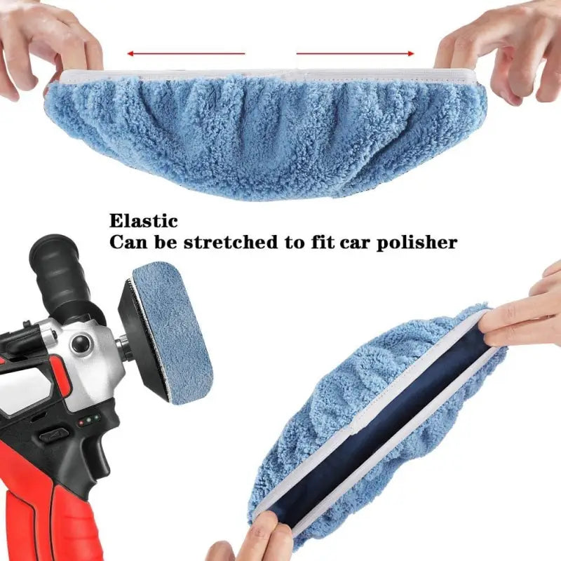 a hand holding a blue towel with a red and black handle