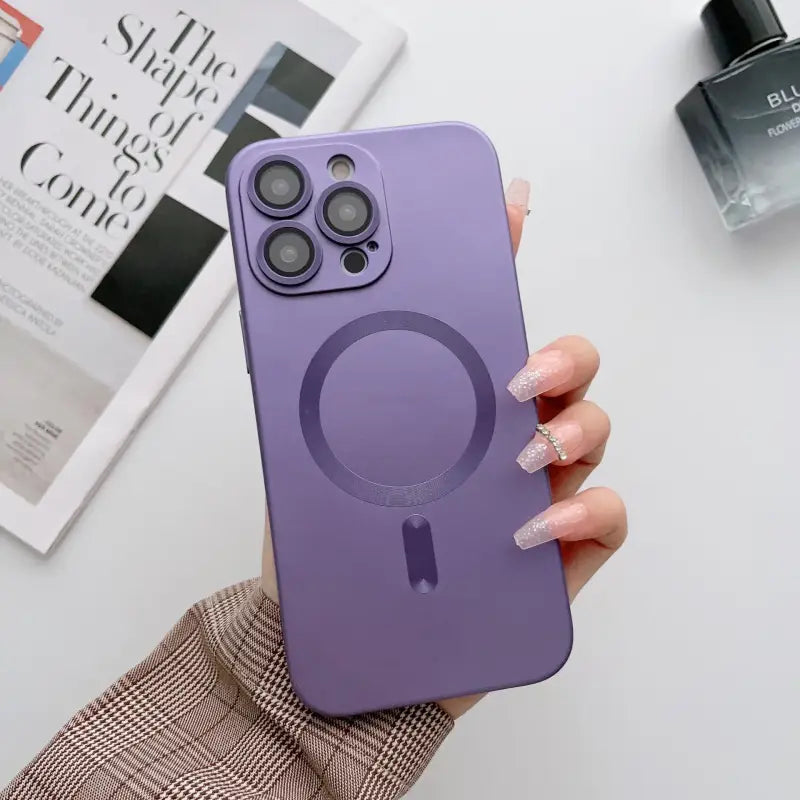 a person holding a purple iphone case