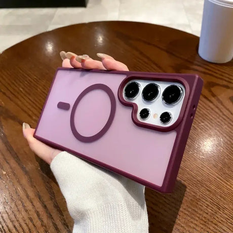 a person holding a purple iphone case