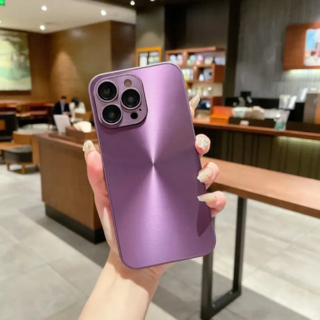 A person holding a purple iphone case