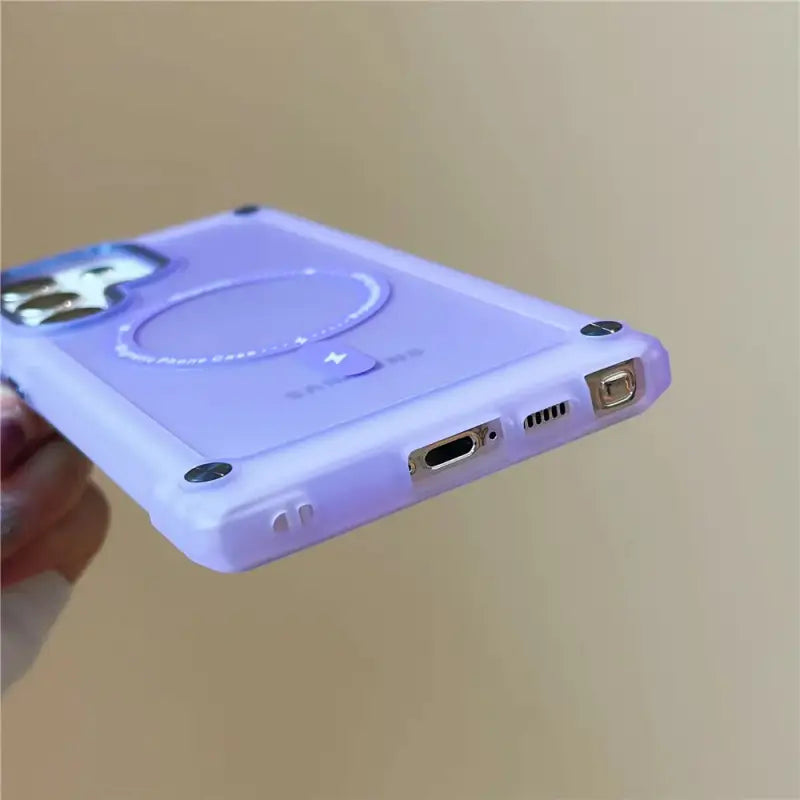 a person holding a purple ipod case
