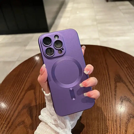 A person holding a purple phone case