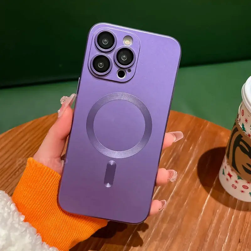 a person holding a purple phone case