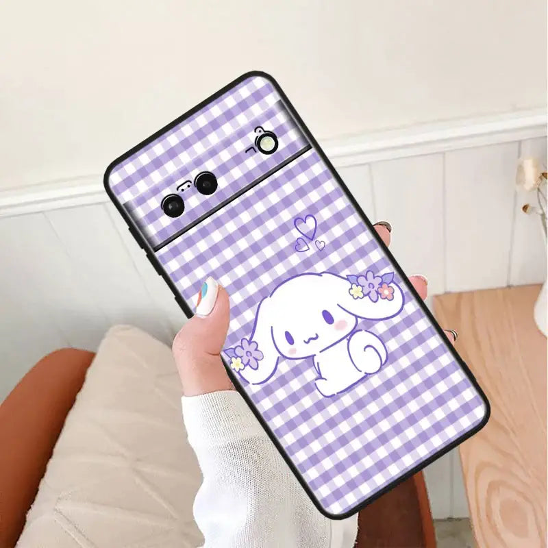 A person holding a purple and white phone case