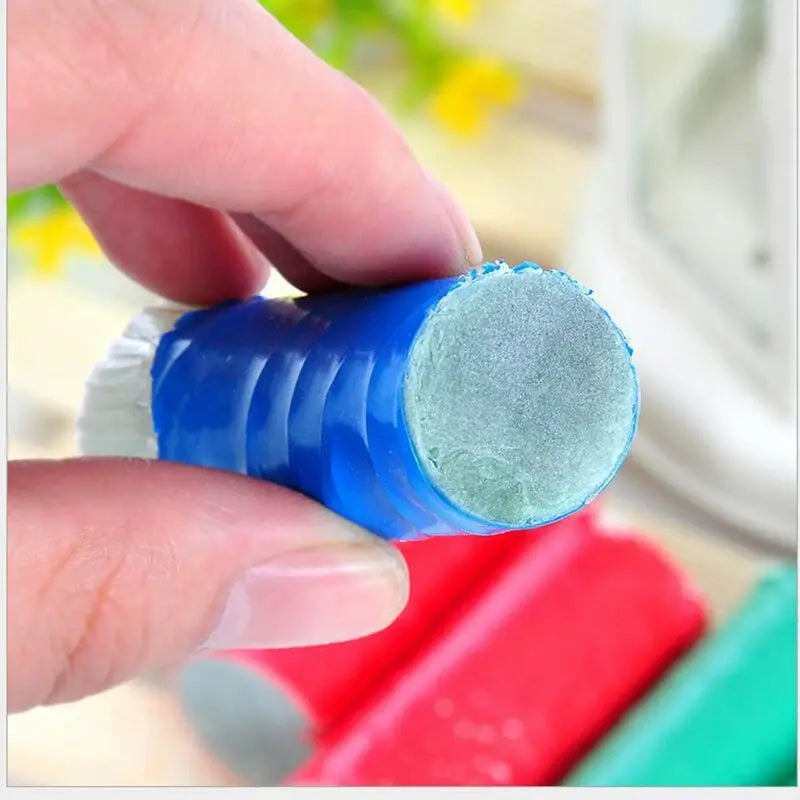 a person is putting a blue bottle with a blue substance