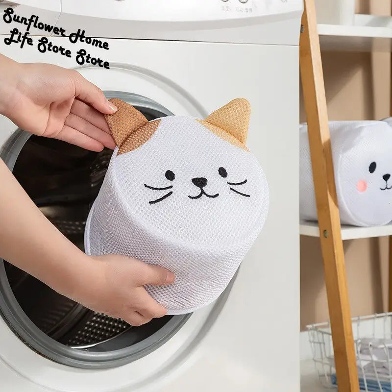a person putting a cat face out of a washing machine