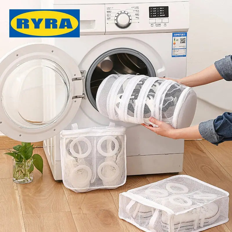 a woman is putting a laundry bag into a washing machine