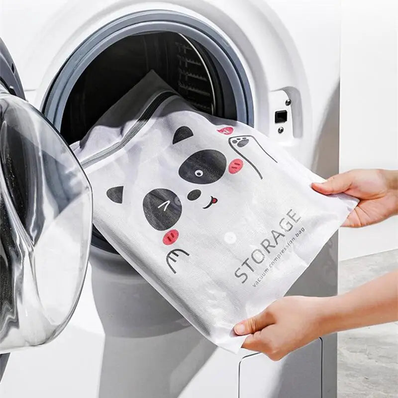 a person putting a towel into a washing machine