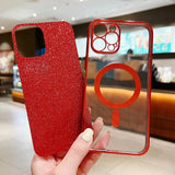 a person holding a red glitter phone case