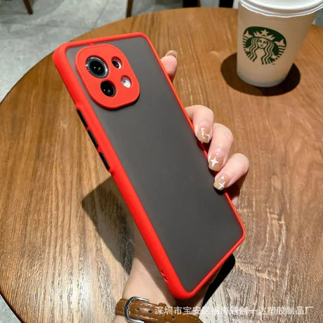 A person holding a red iphone case