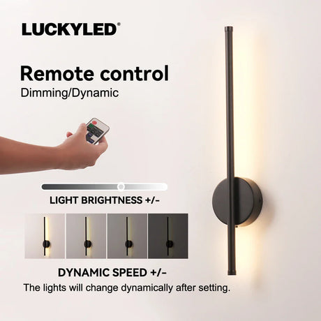 a person holding a remote control light