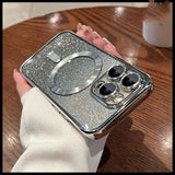 a person holding a silver glitter phone case