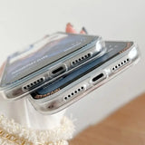 a person holding a silver iphone