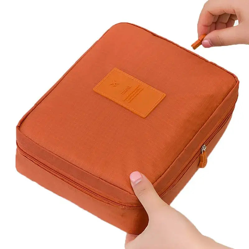 a person holding a small orange bag