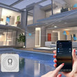 A person holding a smart device near a pool