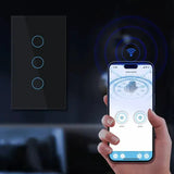 A person holding a smart phone with the app control button on it