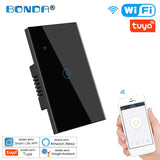 A person holding a smart phone and a smart wifi light switch