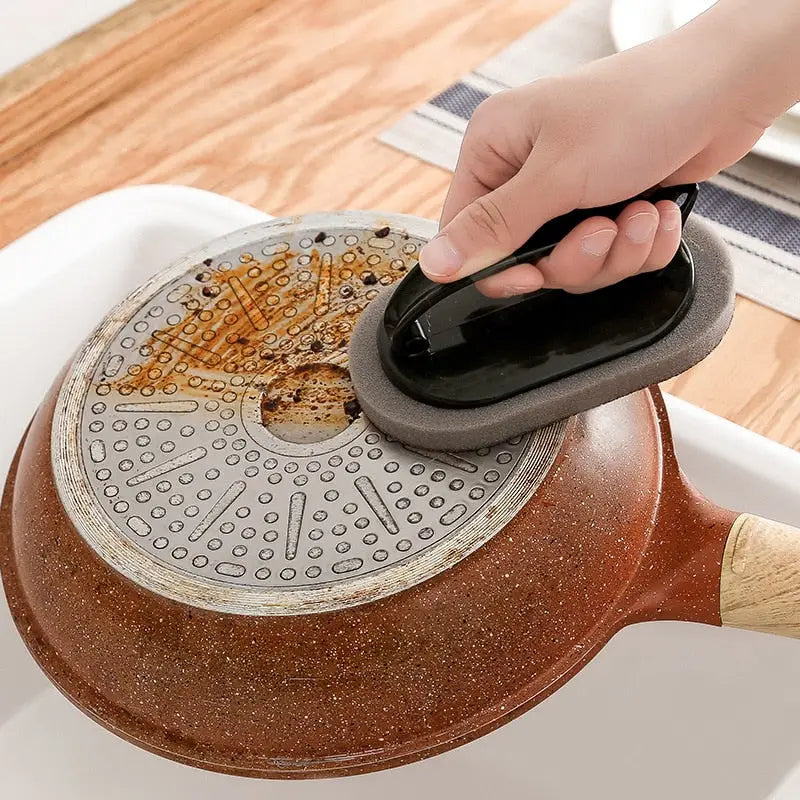 a person using a spat to remove the mold from the cake