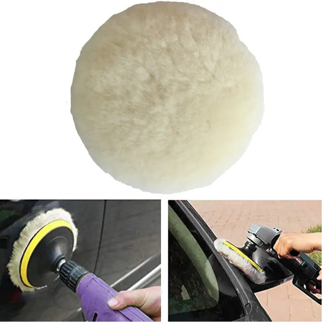 a person using a sponge to clean the car