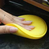 a person is putting a sponge on a counter