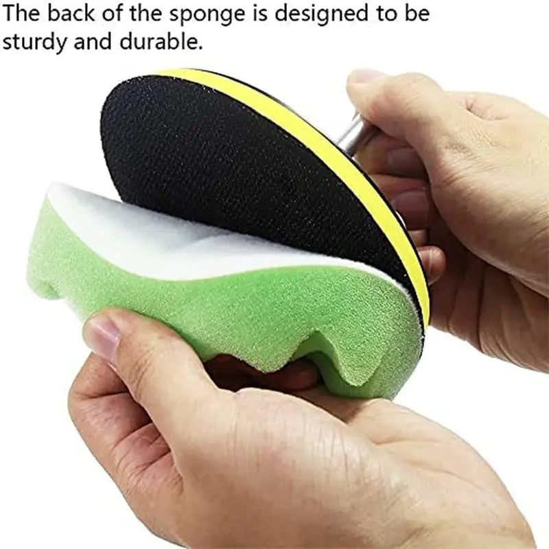a person using a sponge to clean the surface of a sponge