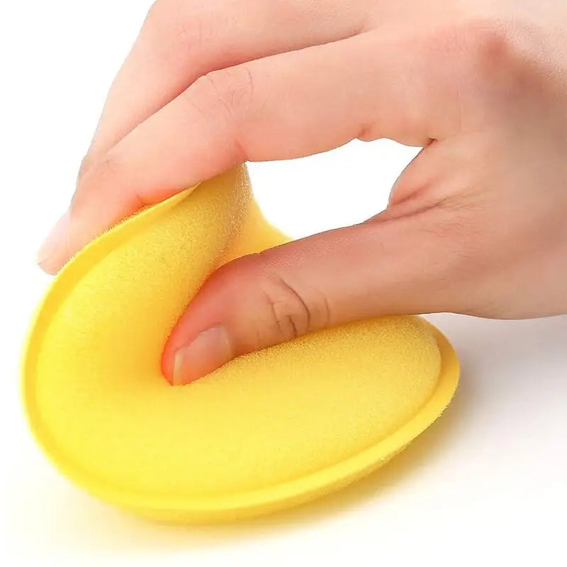 a person using a sponge to clean the surface