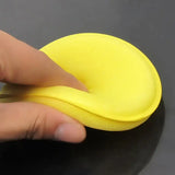 a person is using a sponge to clean the surface