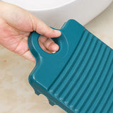 a person using a sponge to clean a toilet