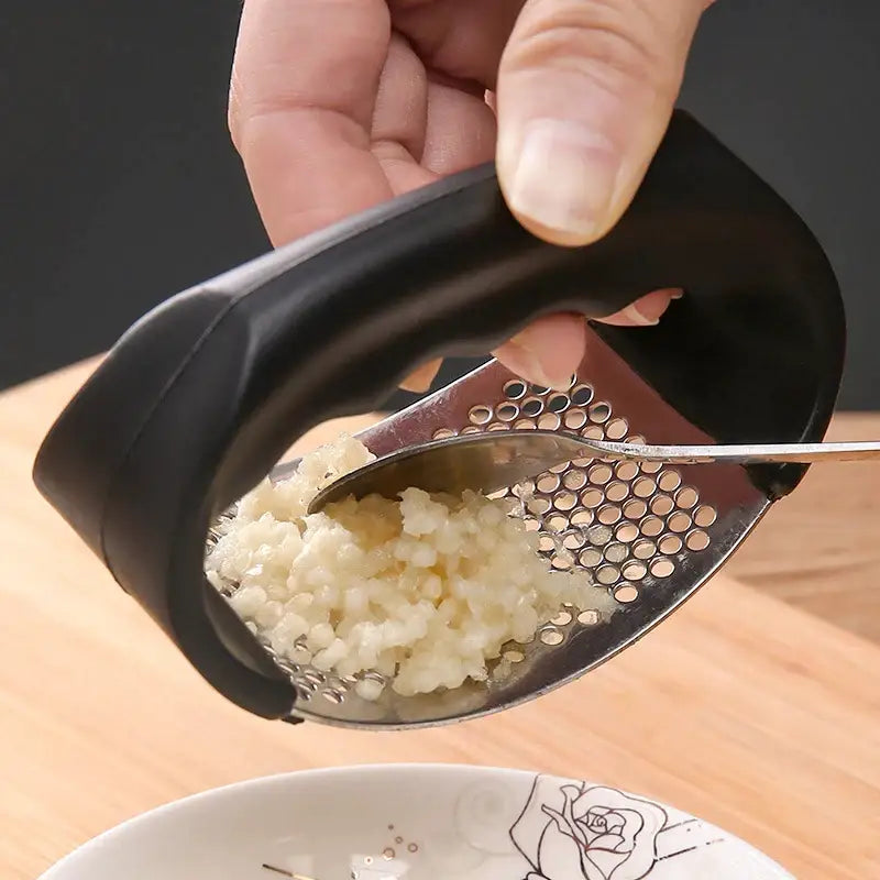 a person is using a spoon to scoop potatoes into a bowl