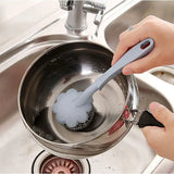 a person is using a spoon to wash a sink