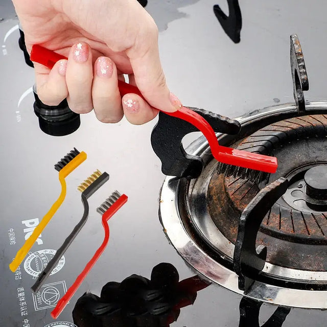 a person is using a red tool to remove the gas from the stove