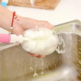 a person washing a bowl with a sponge