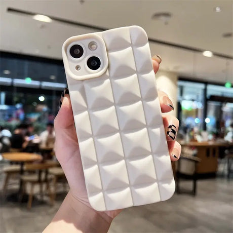 A person holding a white iphone case