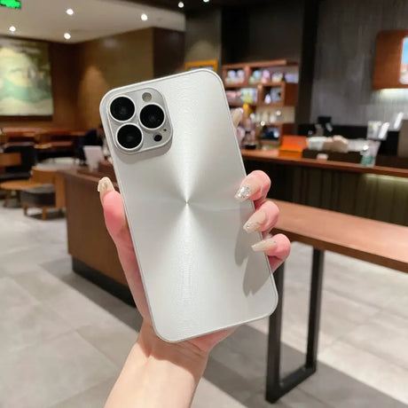 A person holding a white iphone case