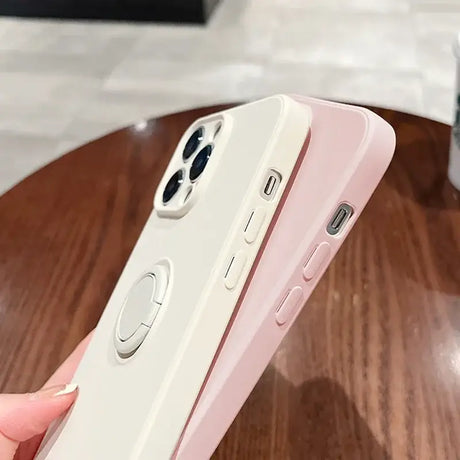 A person holding a white iphone case