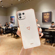 a person holding a white iphone case