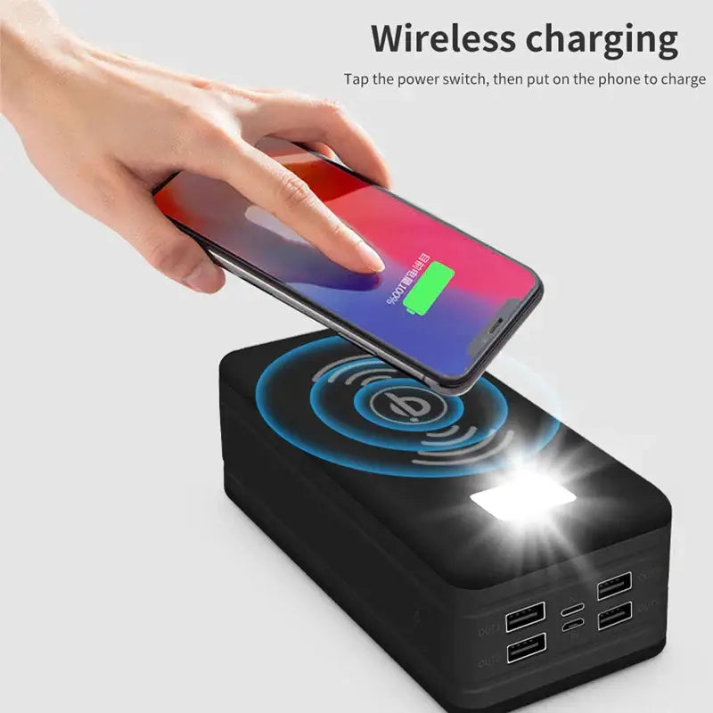 a person using a wireless charger to charge their phone