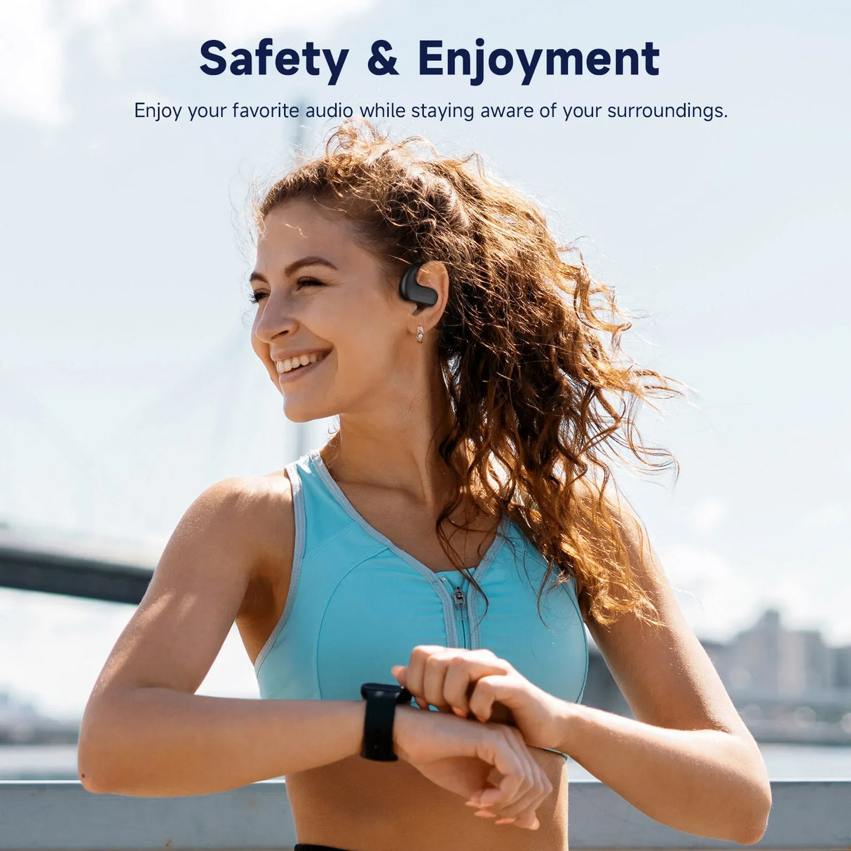 Smiling person wearing wireless earbuds and a fitness tracker while exercising outdoors.