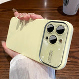 a person holding a yellow iphone case