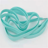 a turquoise colored ribbon with a white background