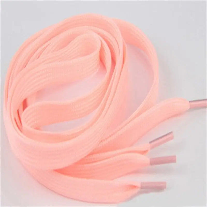 a pink shoelacet with a white background