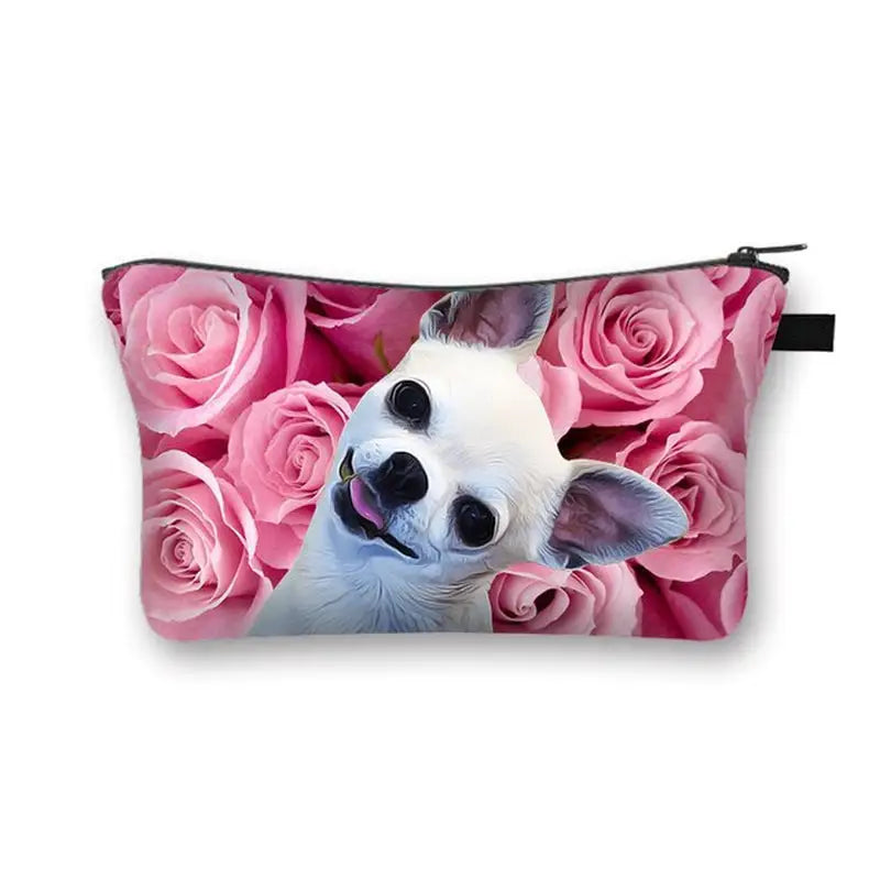 a small cosmetic bag with a small dog in the middle surrounded by pink roses