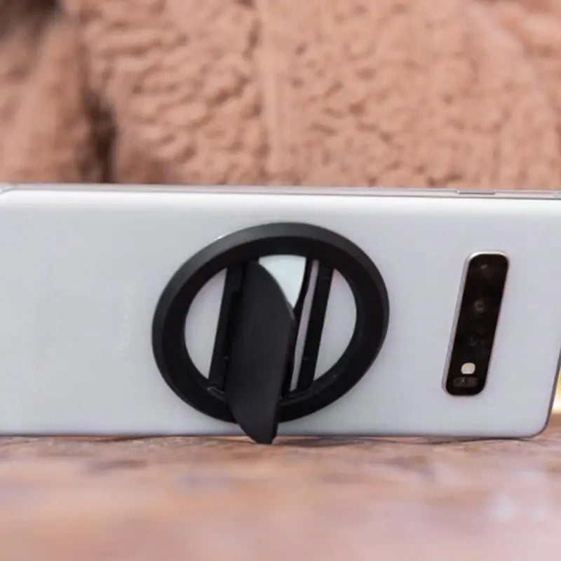 a phone with a black ring on it