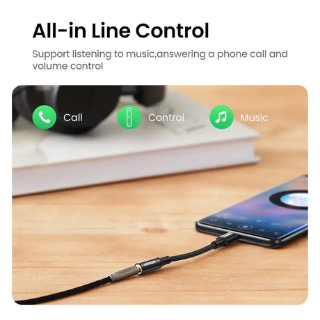 A phone with a charging cable attached to it